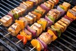 high angle view of swordfish kebabs on a barbecue pit