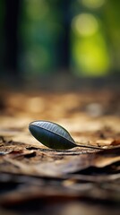 Sticker - A leaf sits on the ground in the middle of a forest, AI