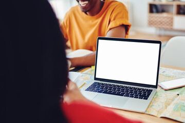 Cropped image of dark skinned male laughing at jokes spending time at office with female colleagues