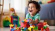 © AspctStyle - Cute little boy playing with colorful wooden block toys on floor at home