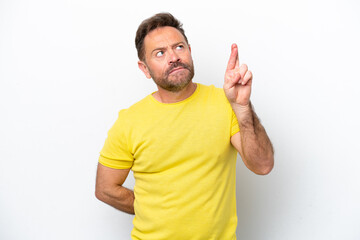 Wall Mural - Middle age caucasian man isolated on white background with fingers crossing and wishing the best