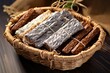 overhead shot of protein bars wrapped in foil lying in a wicker basket