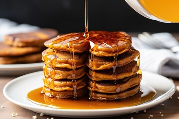 Wall Mural - vegan sweet potato pancakes with maple syrup dripping down the side