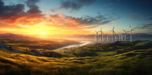 Wind Turbines In A Green Field At Sunset