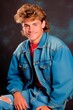 © XC Stock - a young man posing with a blue jacket and jeans,  in 80´s or 90´s american yearbook vintage retro  style