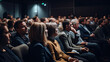 © Nhan - an audience in an auditorium watching a presentation, Rear view of people in audience at the conference hall, Speaker giving a talk in conference hall at business event