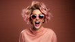 Portrait of satisfied overjoyed woman wear stylish clothes shouting yeah win. Isolated on pink color background