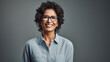 © Synthetica - Smiling middle aged businesswoman in eyeglasses over autumn park outdoor background.