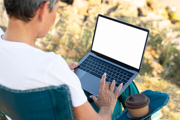 Mature Lady Working On Laptop Empty White Screen Outdoor, Closeup