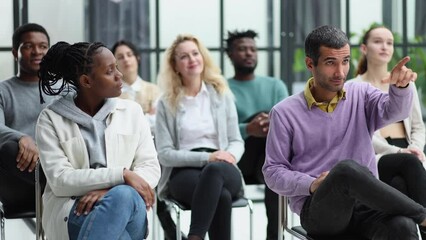 Wall Mural - Different groups of people communicate with each other during business seminar or training.