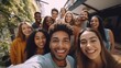 Multi ethnic student guys and girls taking selfie outdoors. Happy lifestyle friendship concept with young multicultural people having fun day together