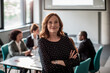 © Marko Geber - Portrait of a businesswoman with arms crossed in the conference room