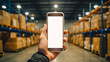 Closeup of man hands using mobile phone in warehouse, white screen, mockup, with industry background. logistic wholesale storehouse, Online shopping concept.