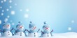 A group of snowmen standing in the snow. This picture can be used for winter-themed designs and holiday greetings.