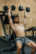 © ADDICTIVE STOCK - Focused dumbbell press