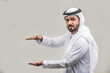 © oneinchpunch - Arabian man wearing traditional emirati dishdasha kandura in studio - Portrait of middle-eastern male adult with beard
