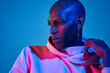 © ADDICTIVE STOCK - Bald stylish man posing on blue background
