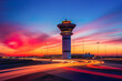© ADDICTIVE STOCK - Generative AI illustration of Dramatic sunset at an airport with a control tower silhouette and vibrant light trails on the runway