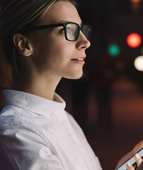 Wall Mural - young woman touching with finger screen while using train schedule application on mobile phone