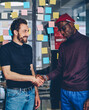 © BullRun - young men doing greeting gesture on meeting in coworking space for collaborating