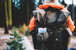 woman hiker with backpack and map looking around and feeling good