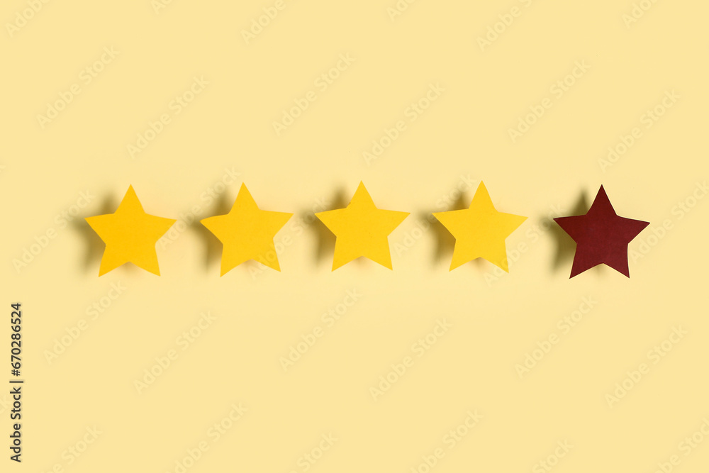 Four out of five stars rating on yellow background. Customer experience concept