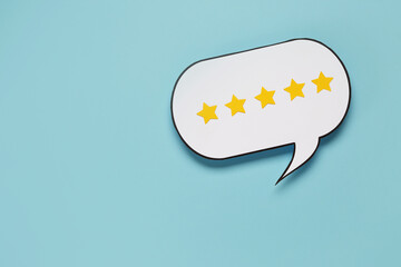 Speech bubble with five stars rating on blue background. Customer experience concept