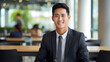 © seogi - A young Asian male entrepreneur dressed in a suit, smiling brightly. - Generative AI