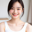 © Daniel Park - A young Asian (Korean) woman with a sweet smile and clean teeth.