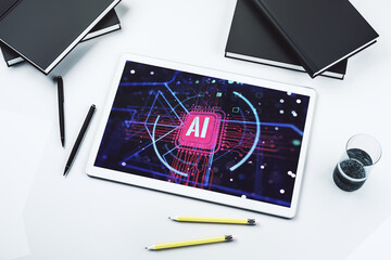 Wall Mural - Top view of modern digital tablet screen with creative artificial Intelligence abbreviation. Future technology and AI concept. 3D Rendering