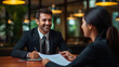 © PRASANNAPIX - Indian insurance sales man or investing advisor explaining the plan to her client.