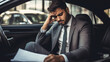 © PRASANNAPIX - Young indian businessman sitting in car and feeling tired