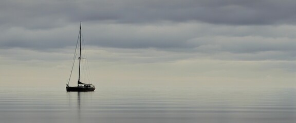 Poster - sail boat on a calm sea