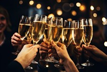 People Raising Glasses For A Midnight Toast With Sparkling Wine, Champagne, Or Non-alcoholic Beverages, Signifying The Beginning Of The New Year