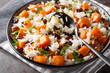 Healthy vegetarian pilaf with sweet potatoes, pecans, onions and dried cranberries close-up in a bowl on the table. Horizontal