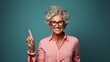 © tanchy25 - Close up portrait of older woman on solide background. Copy paste place. AI generated