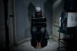 © Leo Lintang - The man was sitting on a chair with tied hands in ropes