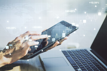 Poster - Multi exposure of abstract financial graph with world map and hand working with a digital tablet on background, financial and trading concept