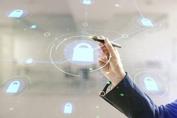 Aufkleber - Double exposure of male hand with pen working with virtual creative lock hologram with chip on blurred office background. Information security concept