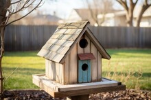 Homemade Birdhouse In An Empty Backyard