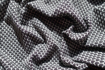 Wall Mural - black and white jersey fabric with honeycomb pattern in soft folds