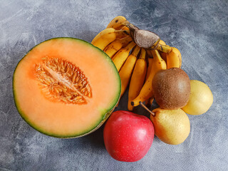 Poster - Colorful group of fresh fruits on black background. Group of fruits. Ripe fruits, Healthy fruits. Top view, Flat lay.