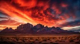 Fototapeta  - Nature background of mountains panorama. Colorful sunset. Northern lights. sunset desert landscape. Wild Western desert sunset with mountains