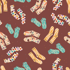 Wall Mural - Vector seamless pattern with multi-colored socks with prints inside.