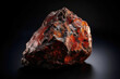 Painite is a rare precious natural geological stone on black background in low key. AI generated.
