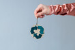 Handmade Christmas decoration in women's hands. Creative symbol of clothing recycling. Ecological and sustainable fashion