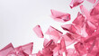 Glass shards scattered and pink with different geometric form on white background