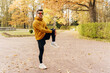 The athlete has an active and healthy lifestyle on weekends in the park. A confident and hardy man running alone. A running coach does a jogging exercise in athletic shoes.