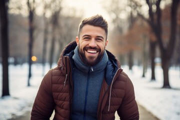 Wall Mural - Portrait of a handsome man in a park. Runner. New year resolutions.