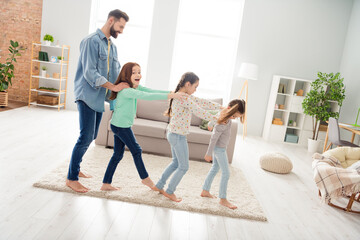 Profile side view portrait of lovely careful funny cheerful family friends friendship walking having fun at home house living-room indoors